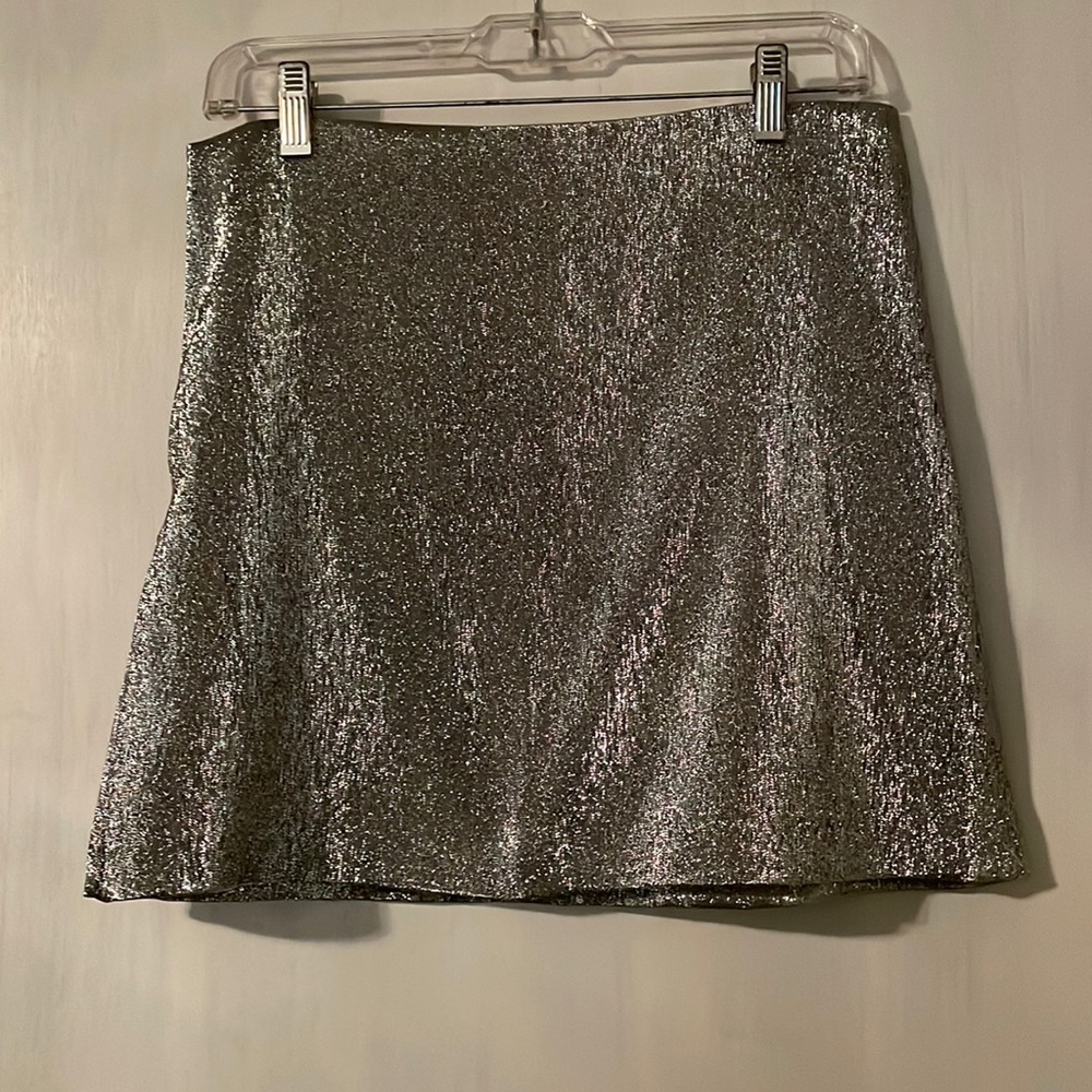 H&M silver shiny mini skirt. Size8 I put it with a shirt I’m selling too see 👀
